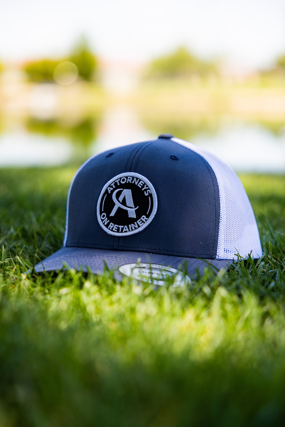 AOR Circle Patch Trucker Hat | Attorneys On Retainer